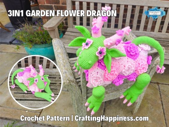 Green and pink 3-in-1 flower dragon crochet blanket displayed on a wooden garden bench, with an inset showing how it folds into a compact plush toy. The dragon features leafy ears, flower-covered wings, floral blanket details, and long legs. Original design by Ariana of CraftingHappiness.