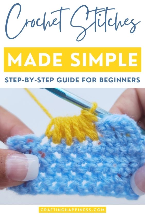 A vertical Pinterest pin graphic with text at the top reading "Crochet Stitches" in blue script, "MADE SIMPLE" in white text inside a prominent yellow block, and "STEP-BY-STEP GUIDE FOR BEGINNERS" underneath. The lower half features a close-up photograph of hands using a teal crochet hook to work a bright yellow cluster stitch into a light blue crocheted swatch. A small yellow label at the very bottom reads "CRAFTINGHAPPINESS.COM".