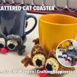 Two crochet splattered cat mug coasters wrapped around a dark blue mug and a mustard yellow mug. The gray and brown cats have oversized eyes, tiny pink noses, and spread-out paws, with a close-up inset showing the coaster shape. Includes the text "Splattered Cat Coaster" and "Free Crochet Pattern | CraftingHappiness.com." Original design by Ariana of CraftingHappiness.